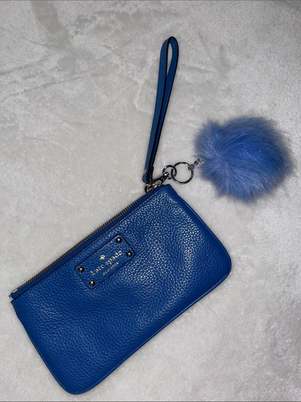 Kate Spade New York Wellesley Leather Wristlet with pom pom